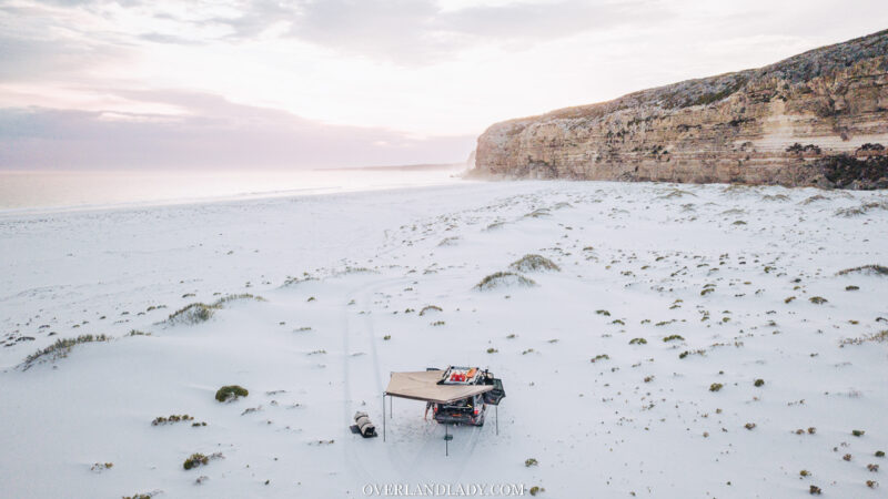 Twilight cove-Toyota Landcruiser 100 series Western Australia white sand beach drone shot
