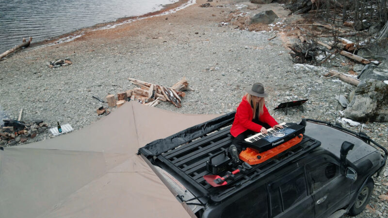 playing the piano on rhino rack landcruiser 100 series overland lady | Overland Lady by Monique Song